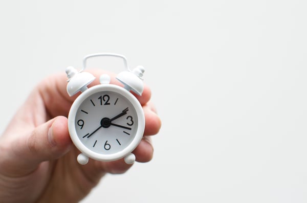 hand holding clock