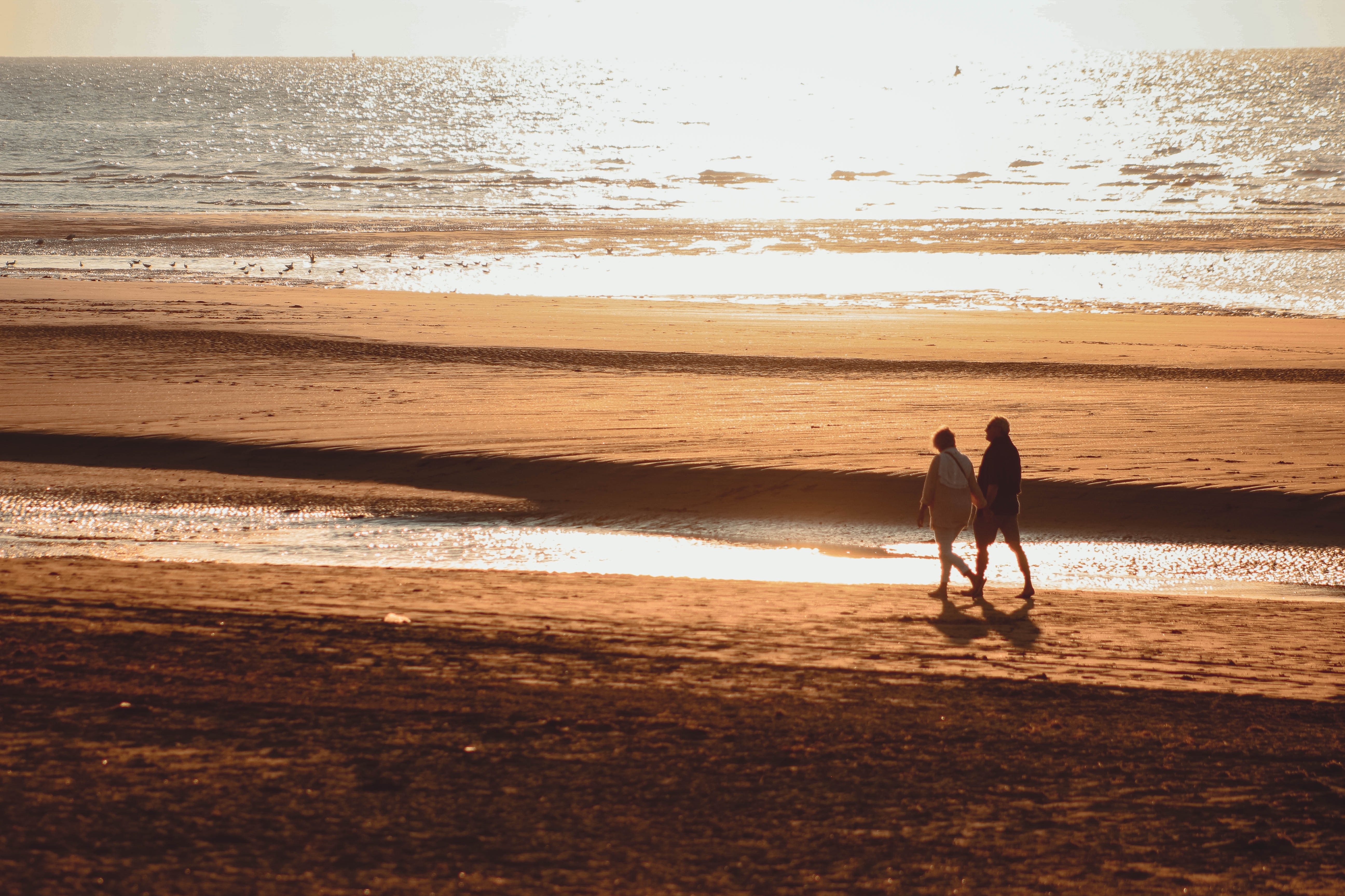 couple walking along a beach
