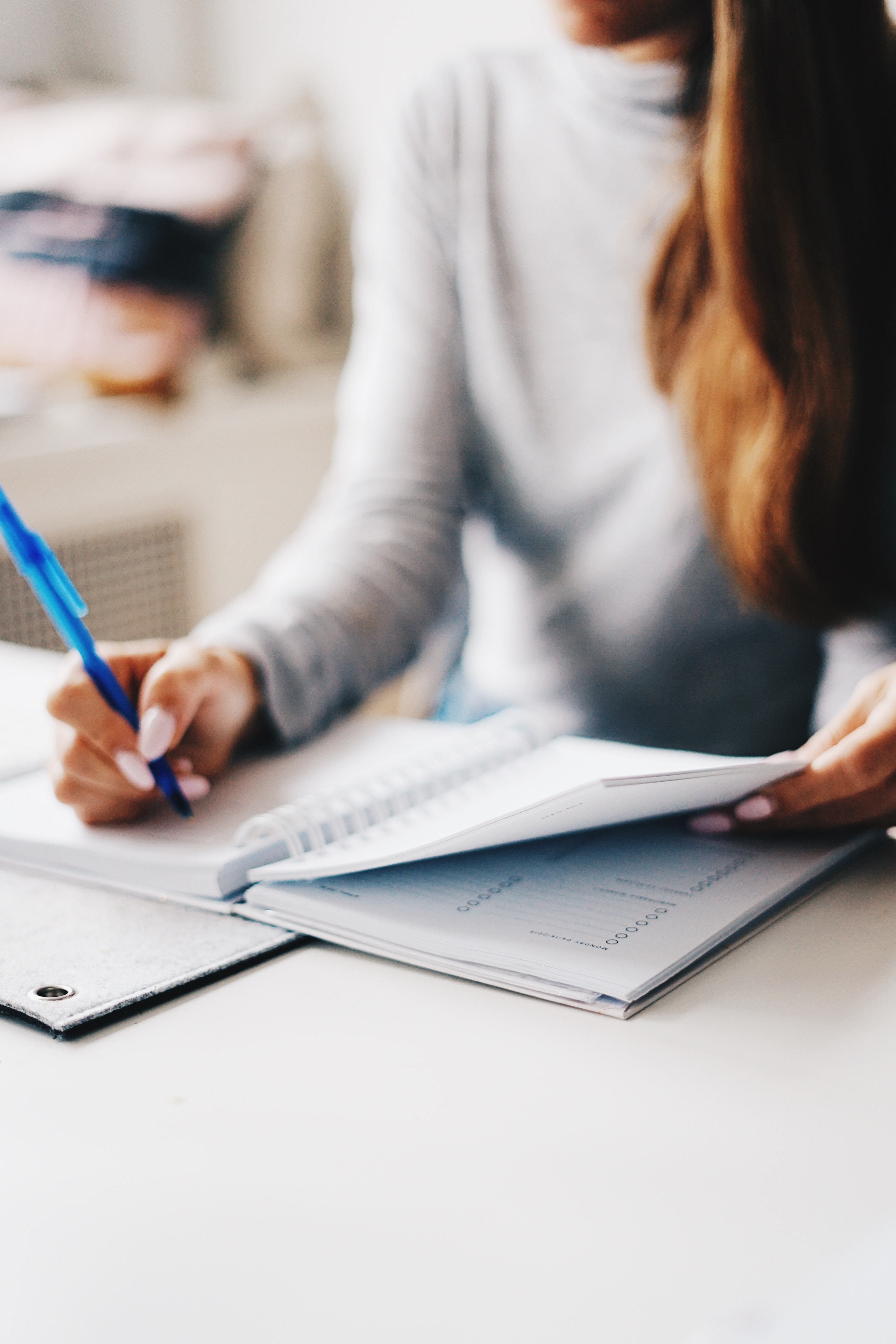 Woman writing in book