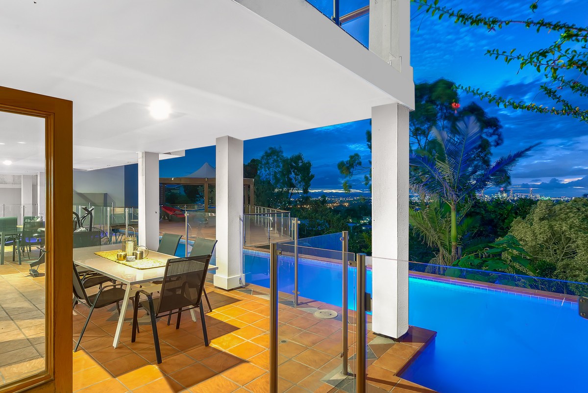 house with a pool and city views